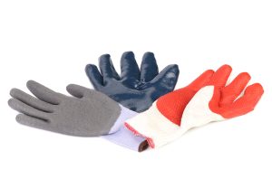 Three different types of protective gloves isolated on a white background. Latex, nitrile and PU. best work gloves for construction